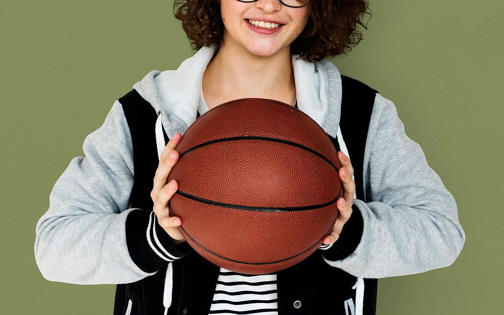 Young Adult Woman with Basketball Studio Portrait