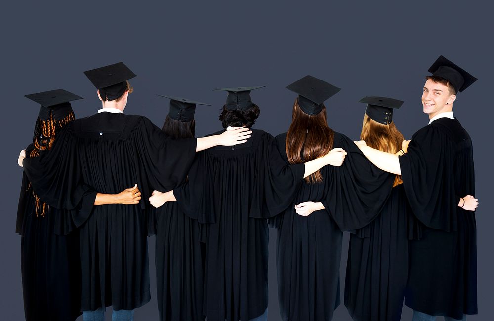 Diverse Students wearing Cap and Gown Studio Portrait