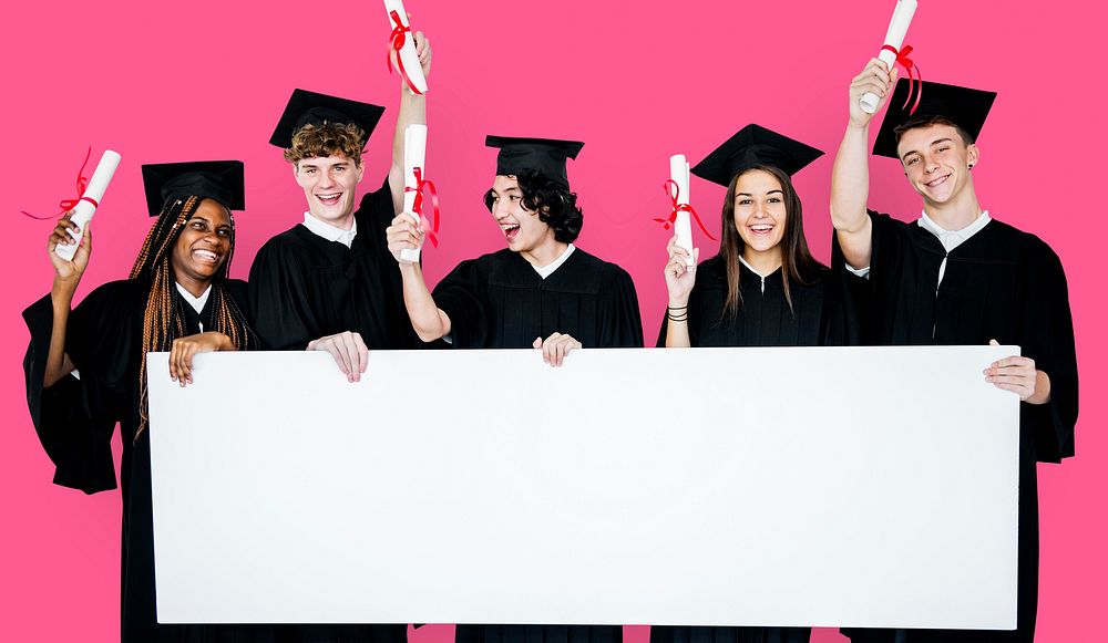 Diverse Students wearing Cap and Gown Showing Blank Copy Space Studio Portrait