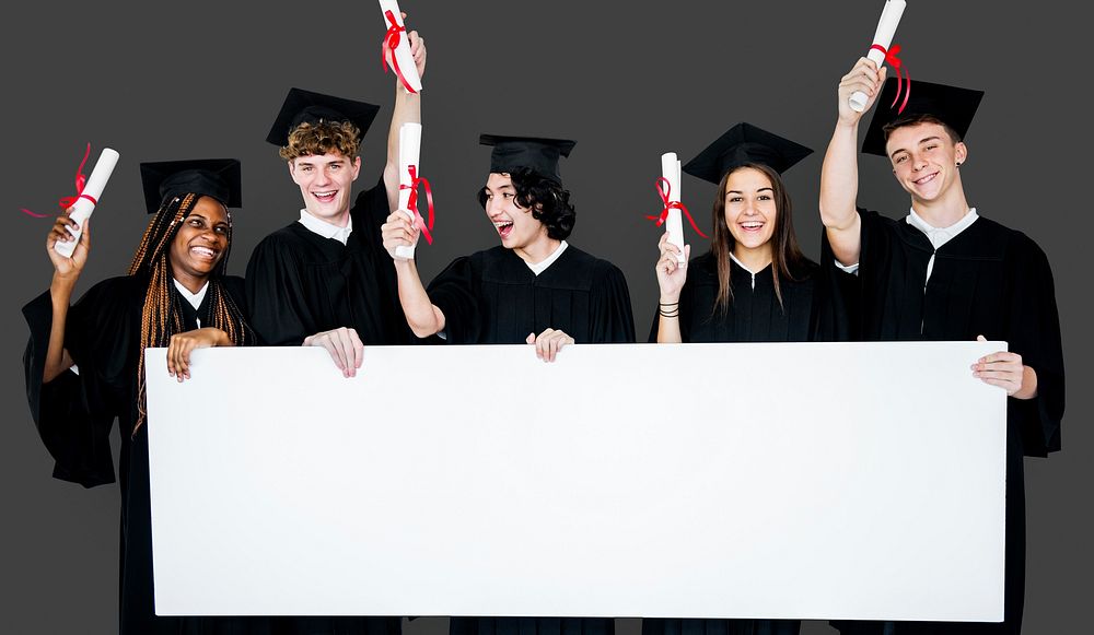 Diverse Students wearing Cap and Gown Showing Blank Copy Space Studio Portrait