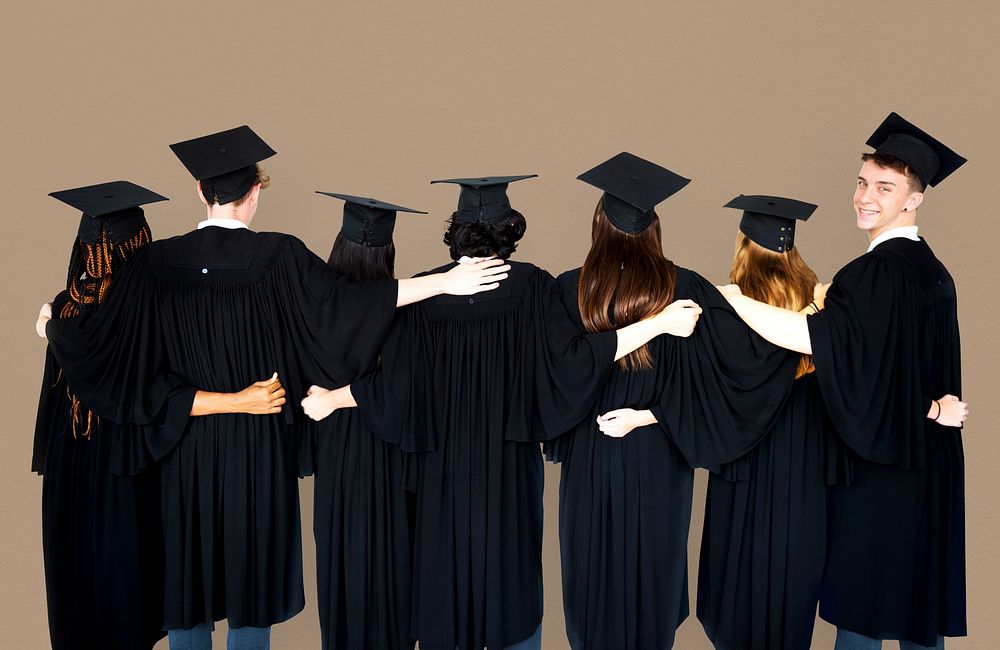 Diverse Students wearing Cap and Gown Studio Portrait