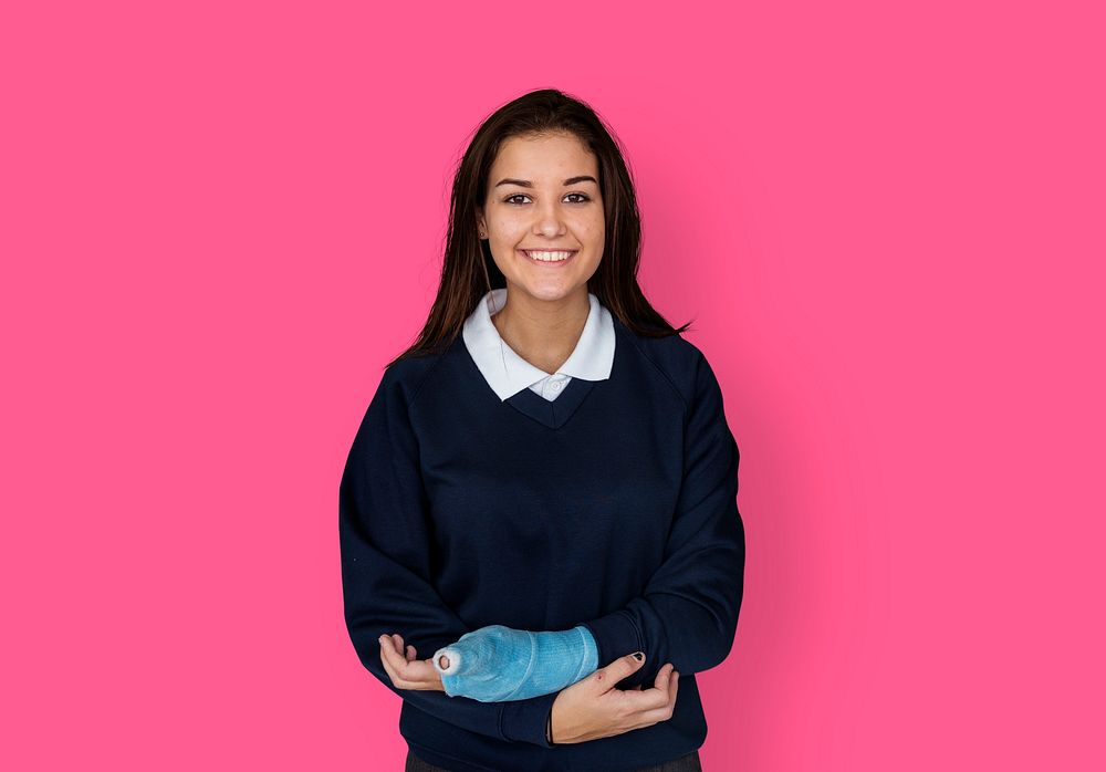 Young Student in Uniform with Broken Arm Studio Portrait