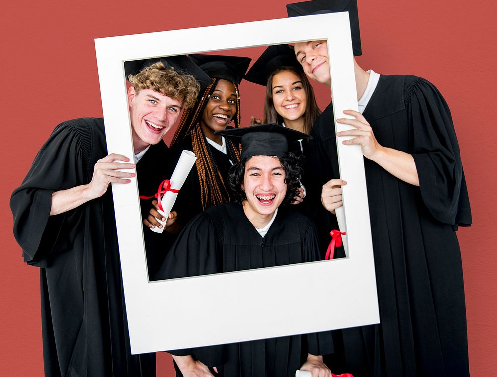 Diverse Students wearing Cap and Gown Holding Photo Frame Studio Portrait