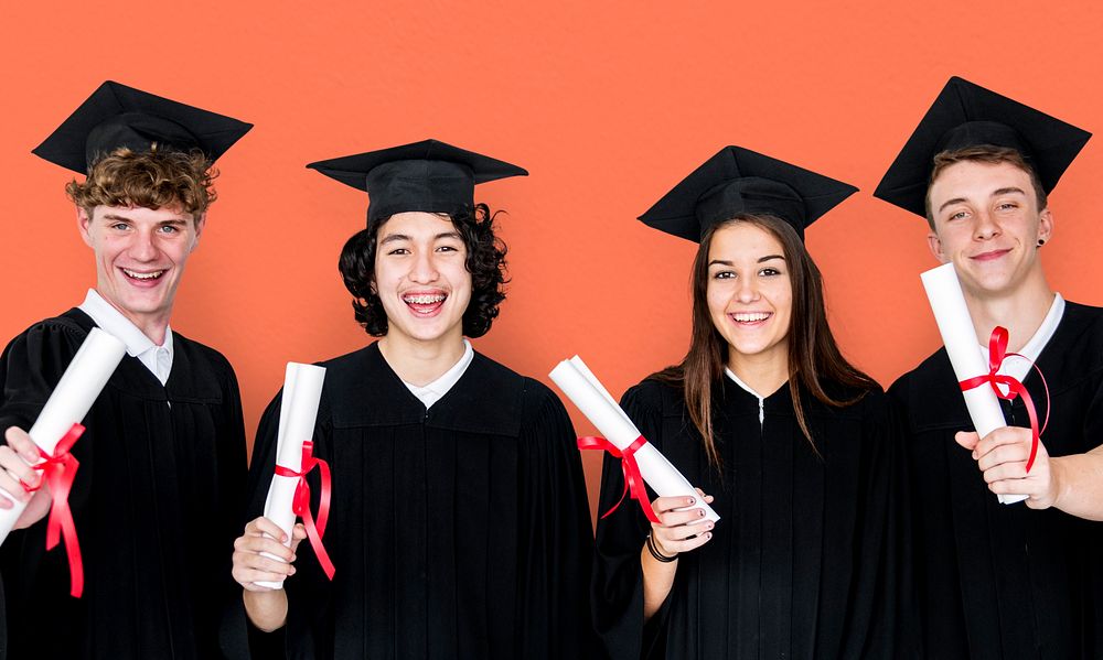 Diverse Group Of Students Holding Diploma