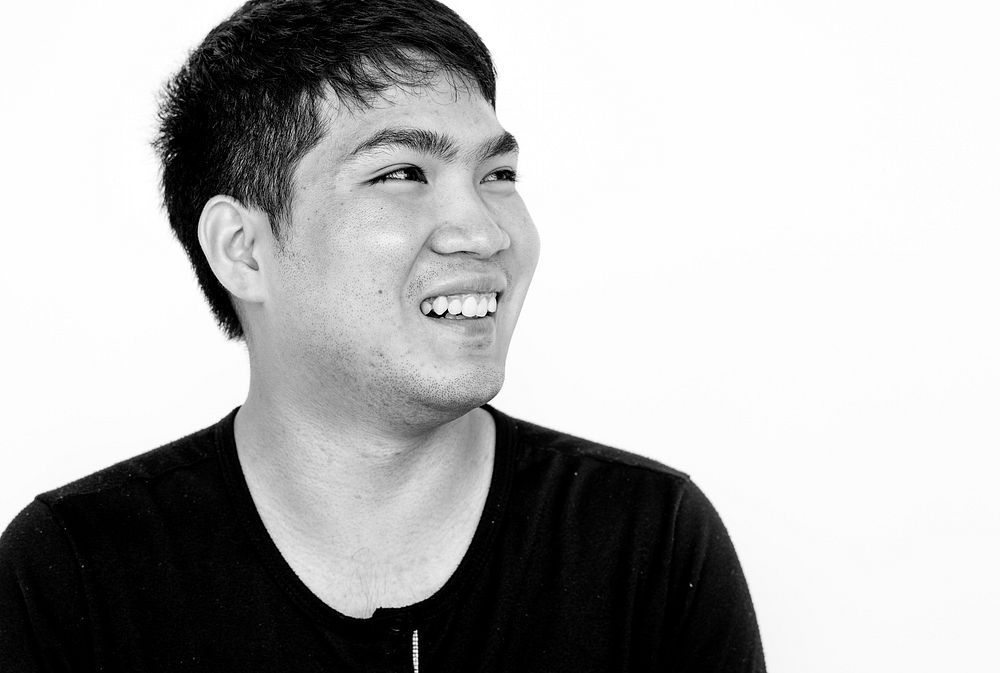 Asian man smiling casual studio portrait