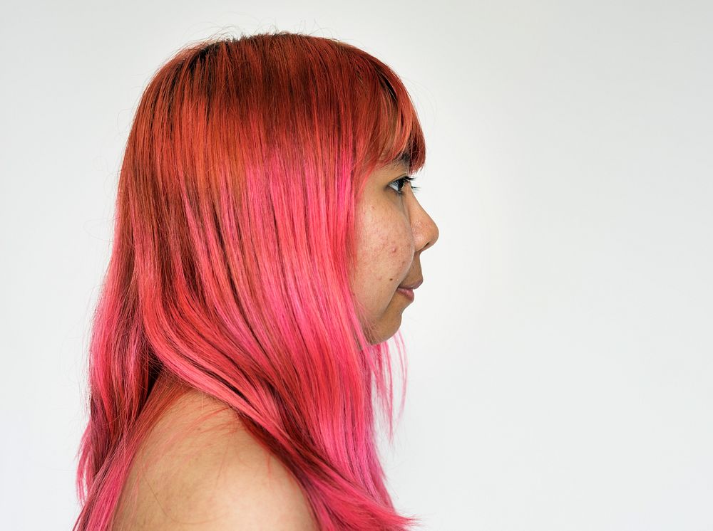 Asian girl pink hair studio portrait