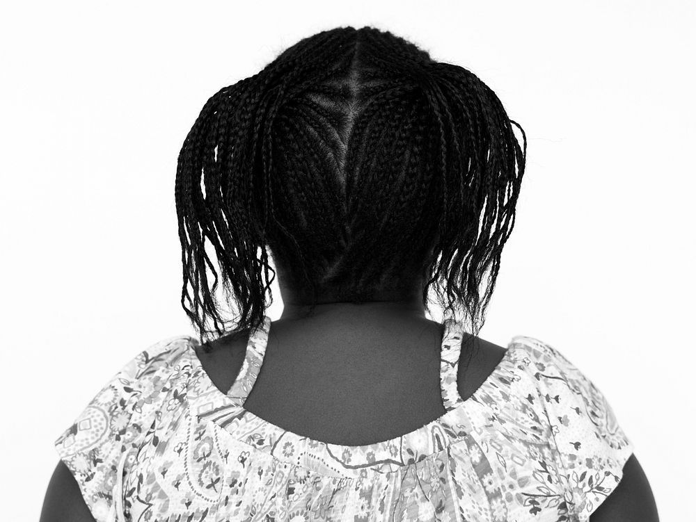 African little girl casual studio portrait in rear view
