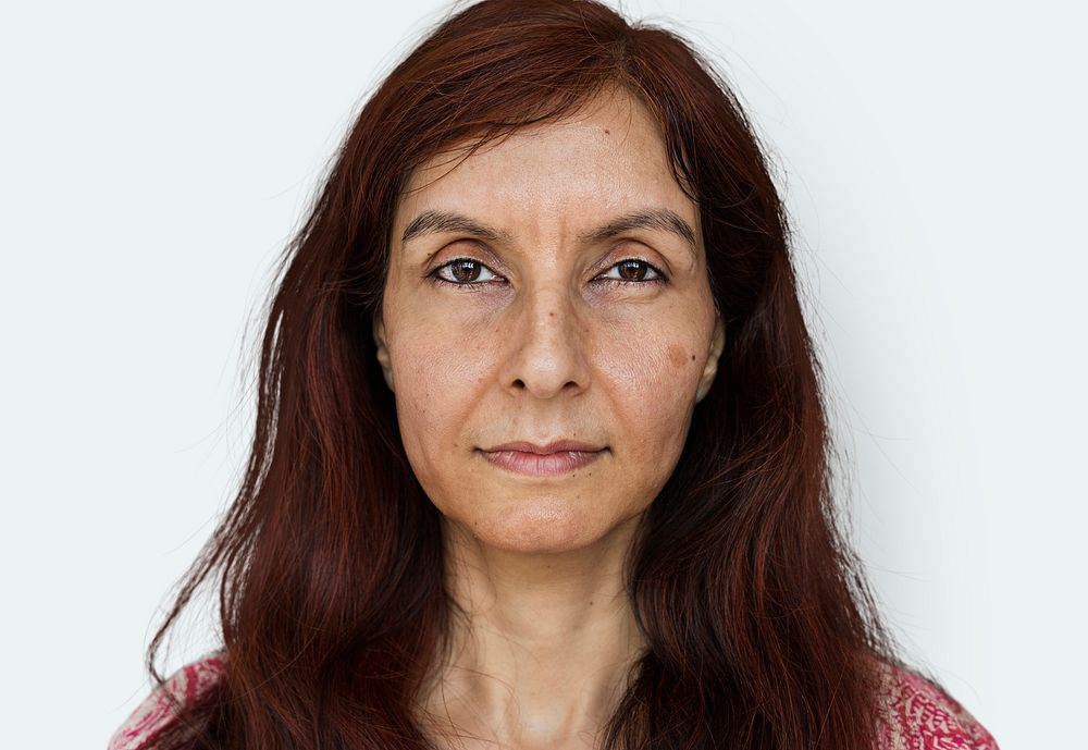 Senior indian woman looking at camera on white background