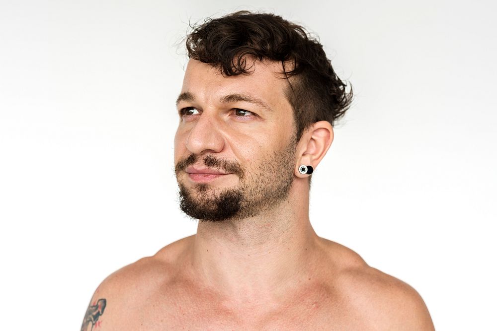 Man photoshooting shirtless in studio