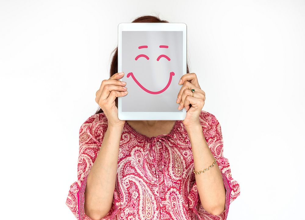 Woman holding digital device covering face photoshooting for photograph