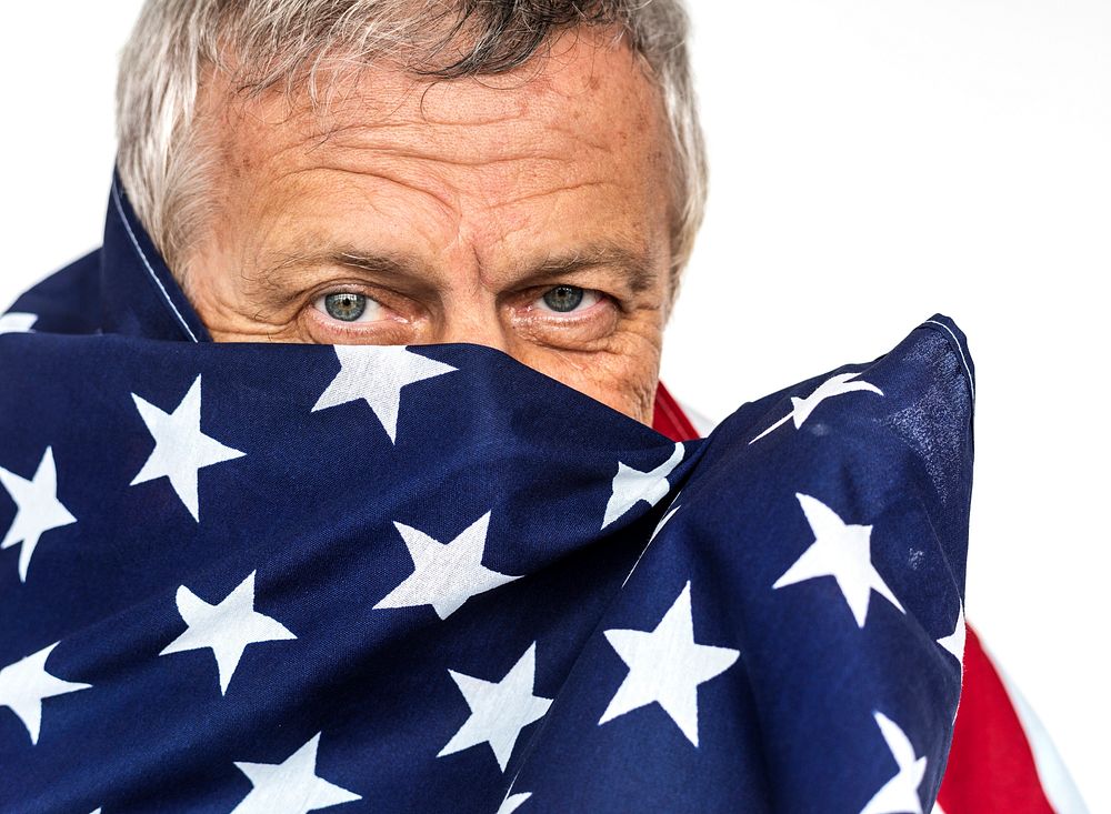 Man holding flag and photoshooting in studio