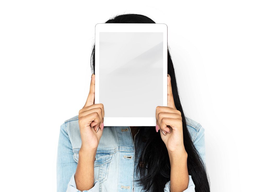 Woman using digital tablet covering her face