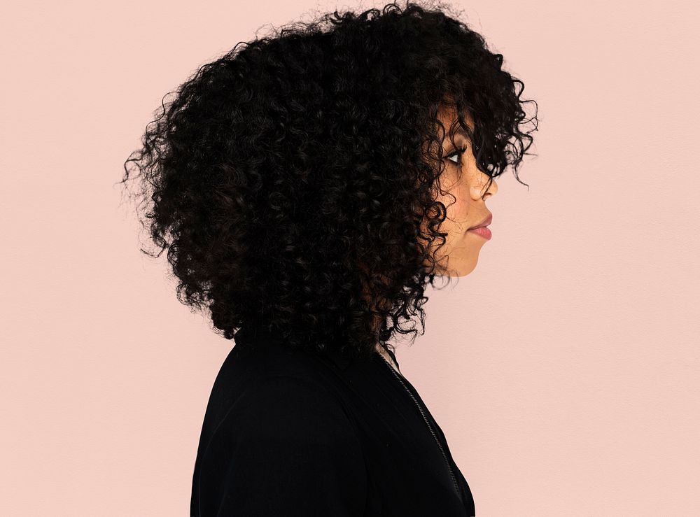 African girl casual studio portrait in side view