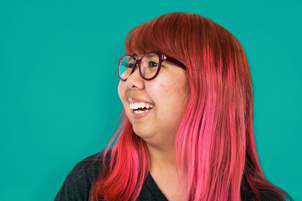 Asian girl pink hair smiling