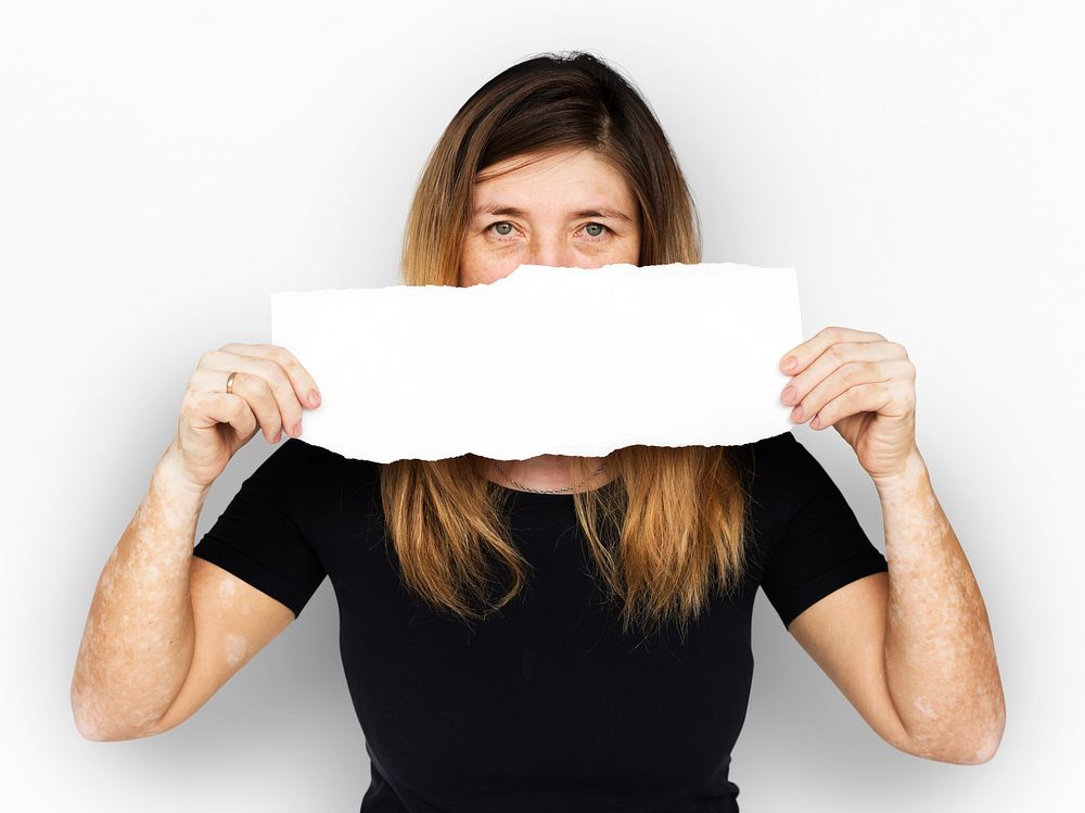 Adult Woman Holding Blank Paper Covered Face Studio Portrait
