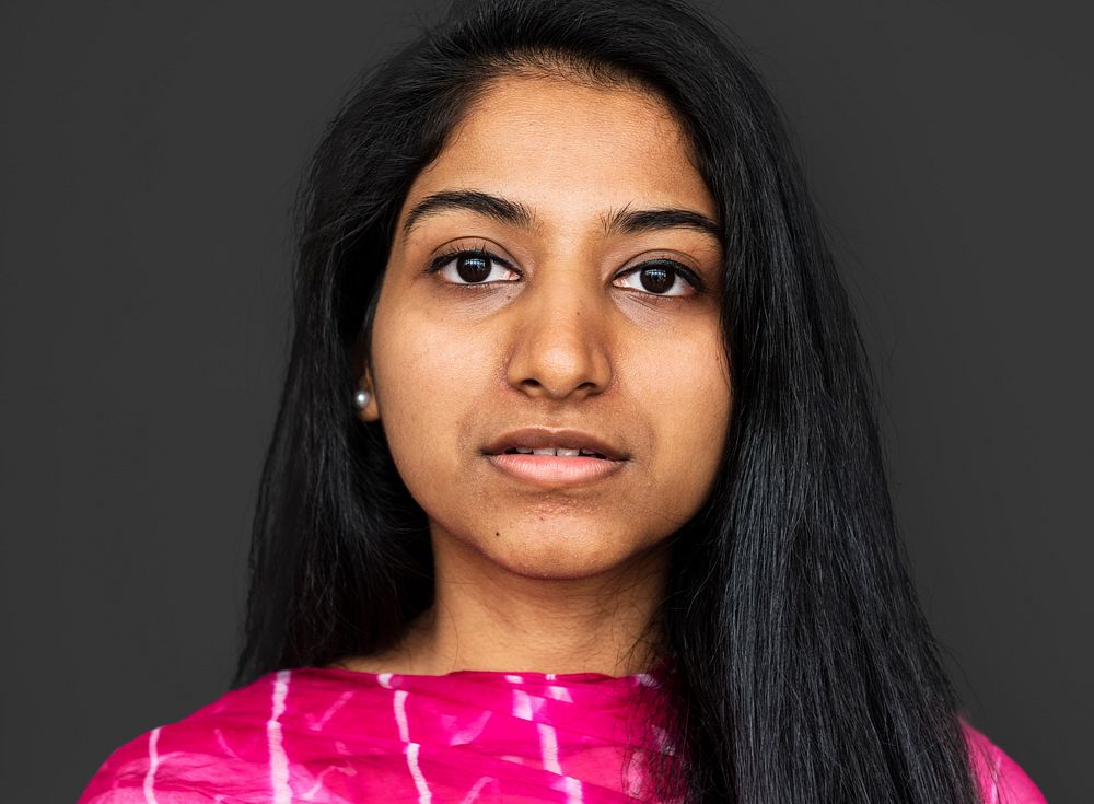 Young woman thinking studio portrait