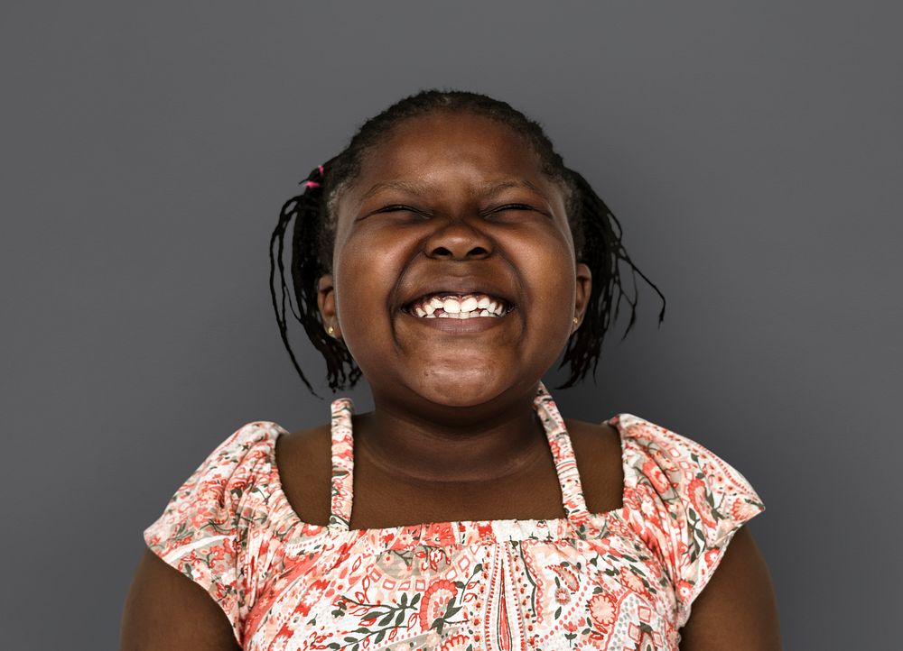 Little african girl smiling casual studio portrait