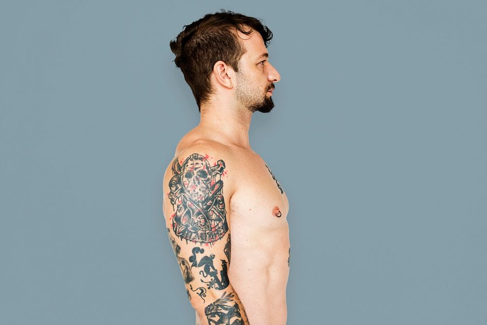 Adult man with tattoo bare chest