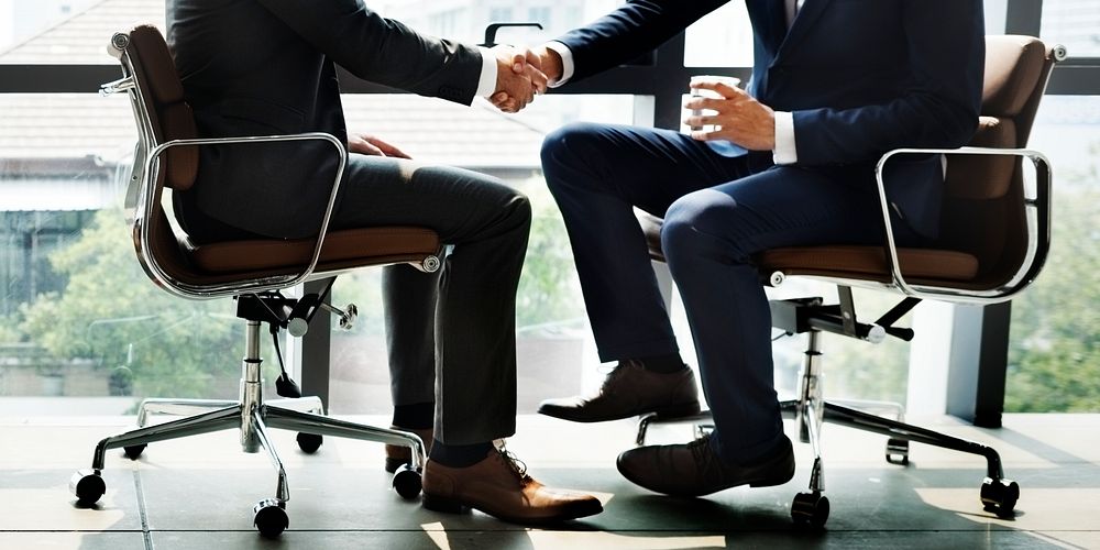 Businessmen Handshake Office Concept