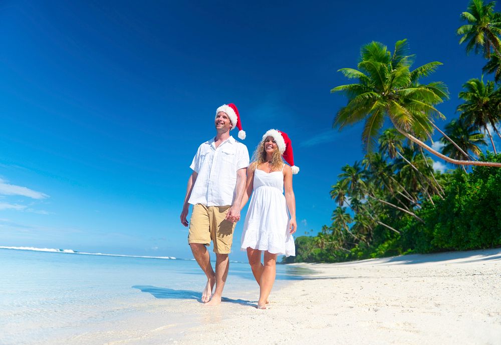 Couple relaxing at a beach in Samoa during Christmas