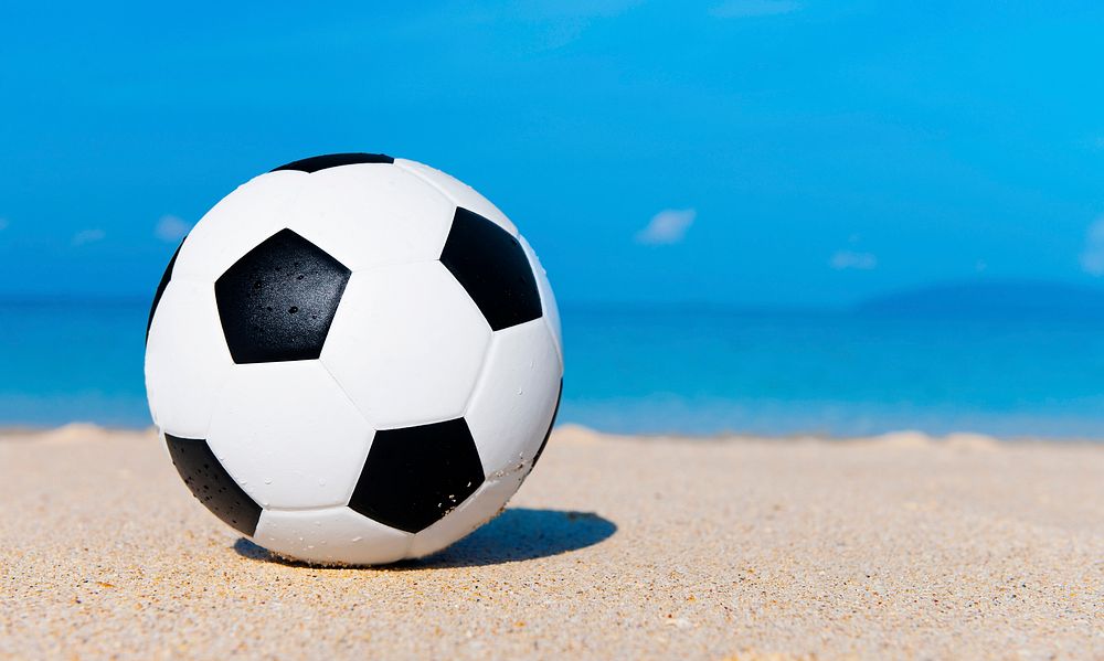 Football on the beach.