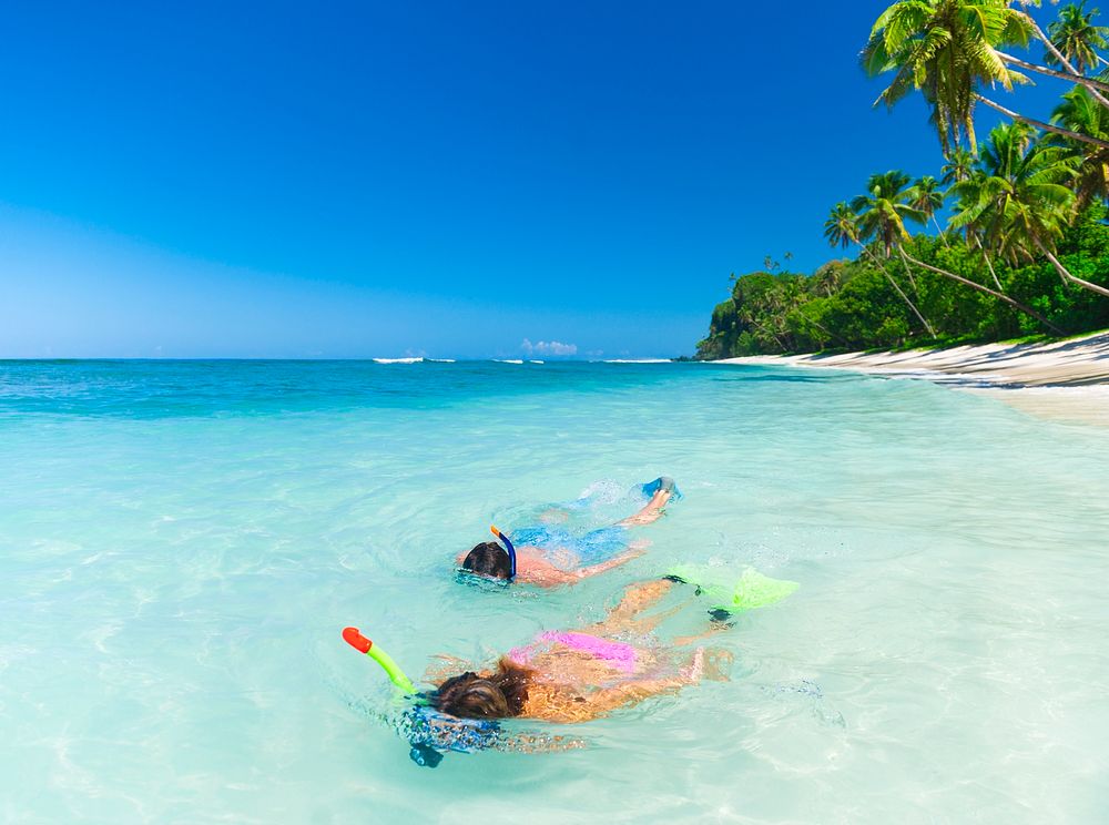 Couple snorkeling by the shore