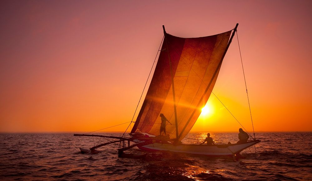 Fishermen on a catamaran at Sunset. Sri Lanka