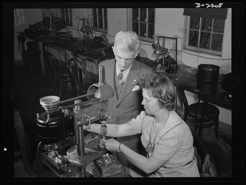 Dante Electric Company, Bantam, Connecticut. Mr. Dante looks on as Mrs. Hazel Wheeler places screws into electric terminals.…