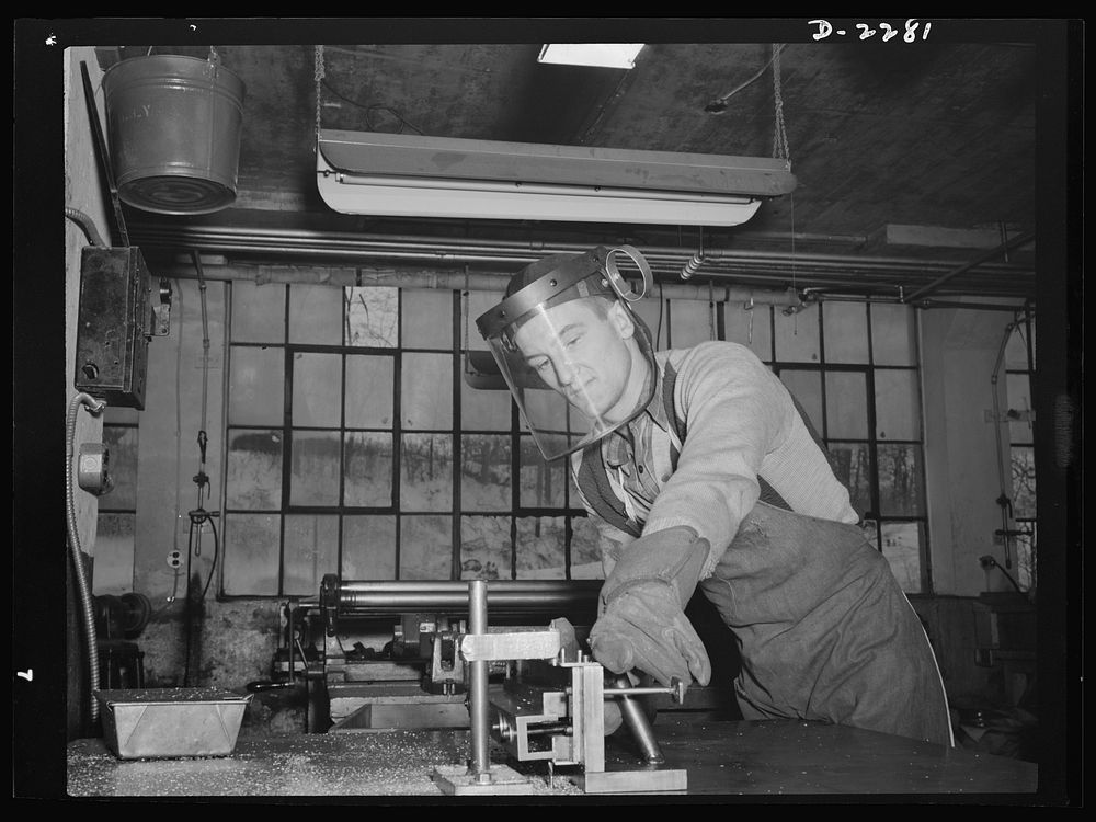 Bantam, Connecticut. Sheet metal foreman at the Warren McArthur plant is John Scott, who formerly worked in Bridgeport at…