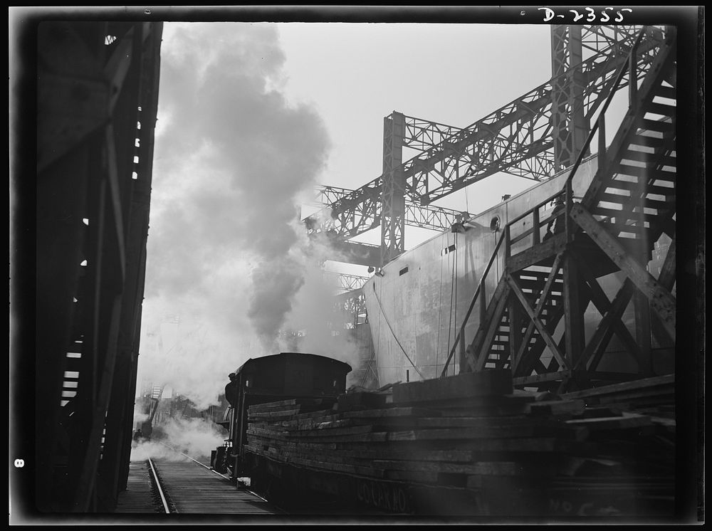 Shipbuilding. "Liberty" ships. Between the ways of this large Eastern shipyard run tracks for flat cars carrying materials…