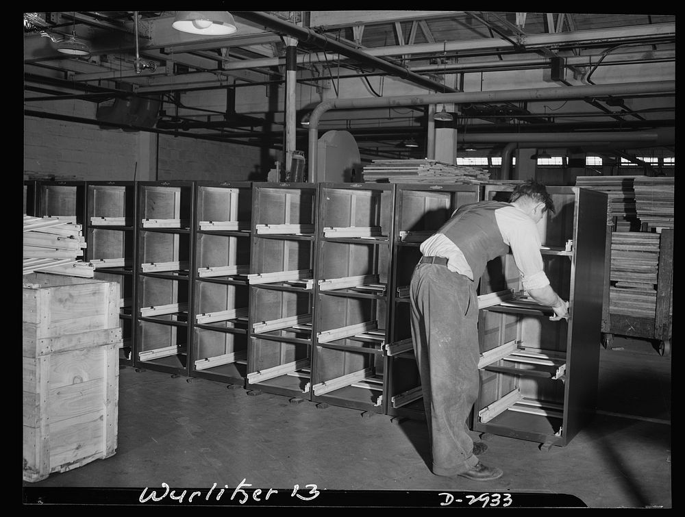 Conversion. Jukebox plant. Pinch hitting for metal, wood is now used in production of file cabinets in wartime America.…