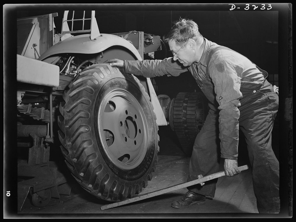 Mounting a wheel on a halftrac scout car is made as simple a job as possible. The soldier in the field won't have the…