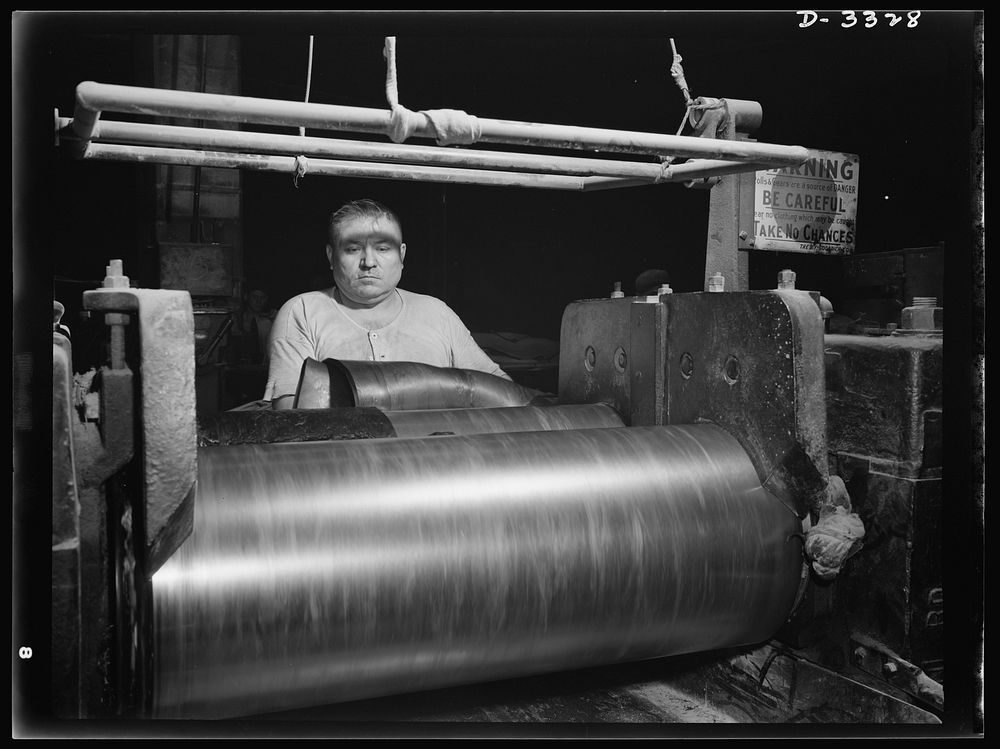 Rubber stock for the track treads of scout cars and other Army halftrac vehicles is milled in one Ohio tire plant. All…