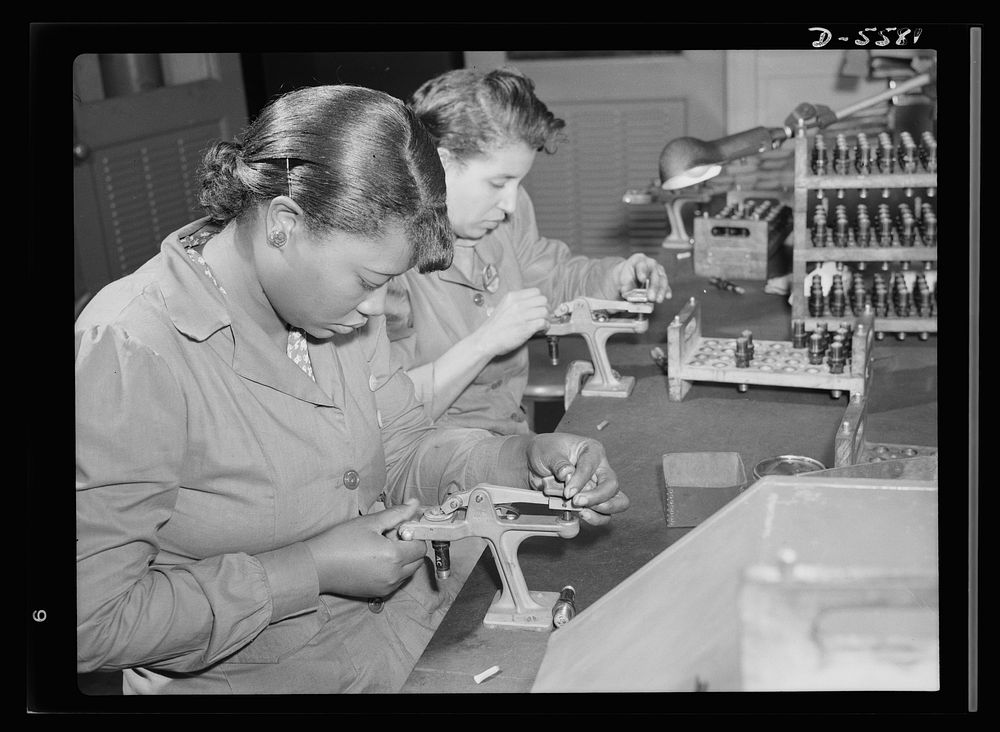 Production. Aircraft engines. African American women with no previous industrial experience are reconditioning used spark…