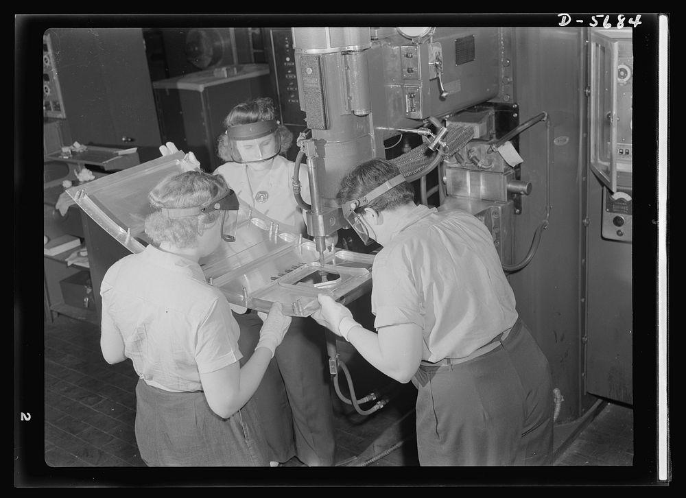 Production. Willow Run bomber plant. Spot welding parts for the nacelle of an aircraft engine. These women work in the…