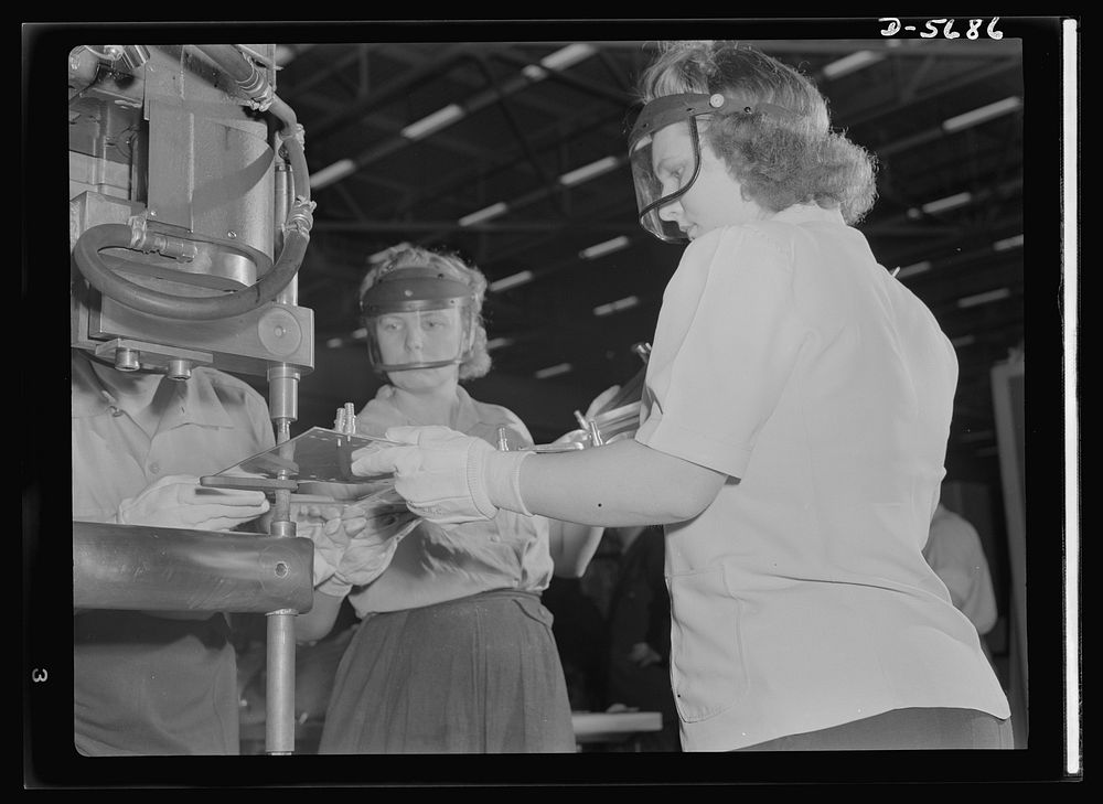 Production. Willow Run bomber plant. Working with skill and precision, these women operate a spot welding machine in the…