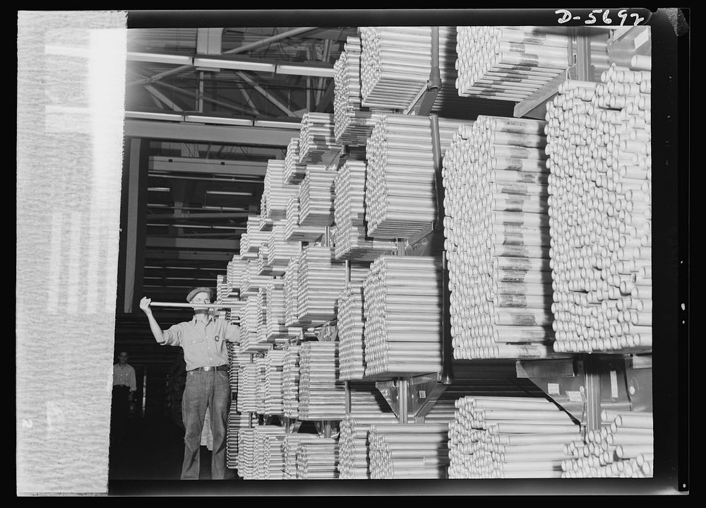 Production. Willow Run bomber plant. Thousands of miles of tubing, stacked in one of Willow Run's enormous supply rooms…