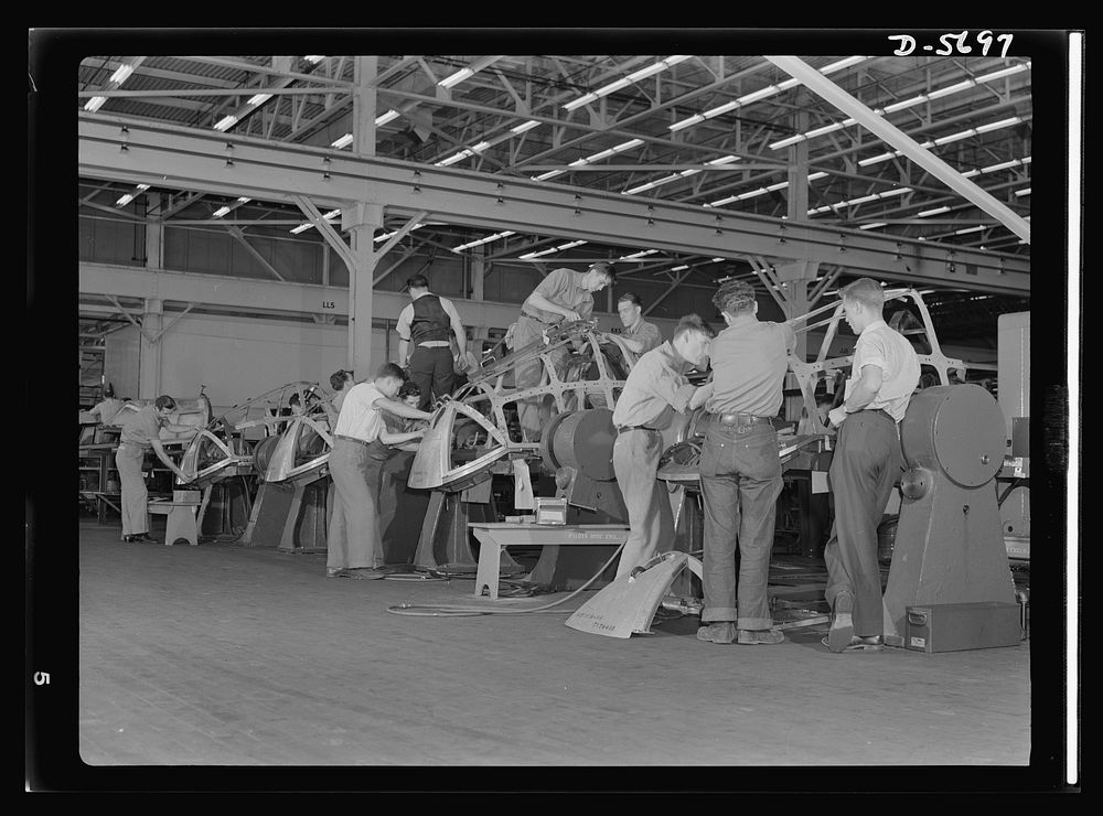 Production. Willow Run bomber plant. Assembly takes place on this lineup of bombardier enclosures in the Willow Run bomber…
