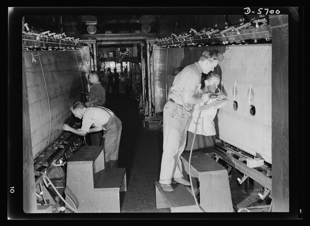 Production. Willow Run bomber plant. The outer wing panel of a bomber undergoes assembly in the giant Willow Run plant. When…