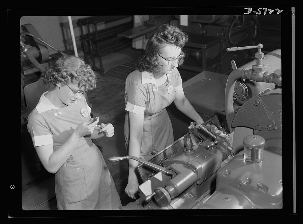 Women in industry. Tool  production. Two to a machine, these young employees of a Midwest drill and tool company are…