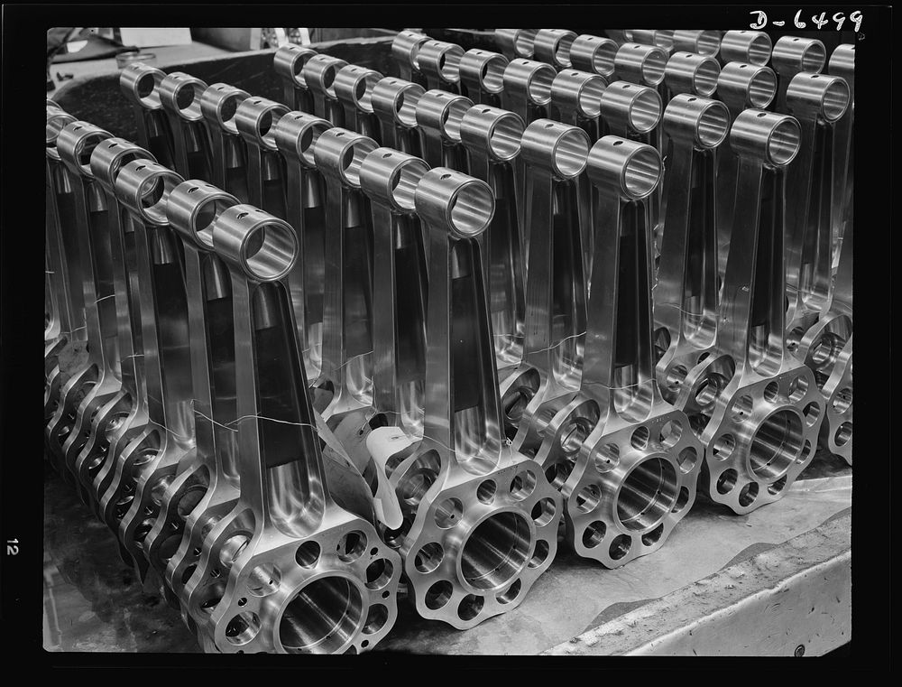 Production. Pratt and Whitney airplane engines. Finished master piston rods of the one-piece type, awaiting assembly in…