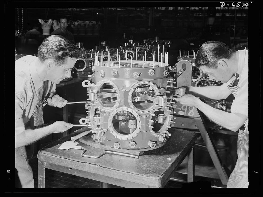 Production. Pratt and Whitney airplane engines. Completing the power section assembly of a Pratt and Whitney airplane engine…