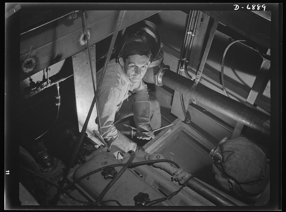 Production. Fifty-foot steel ramp boats. Mounting the power plant of a fifty-foot steel ramp boat in a Southern boatyard.…