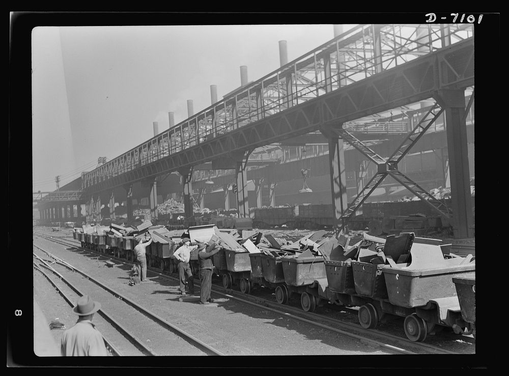Salvage. Scrap for steel mills. Lineup of charging boxes awaiting the signal to start on the journey to the furnace floor of…