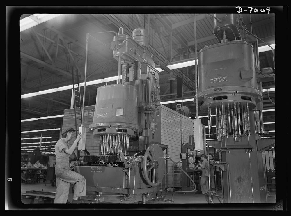 Women in war. Supercharger plant workers. A man-sized machine and a man-sized job are effectively handled by 21-year-old…