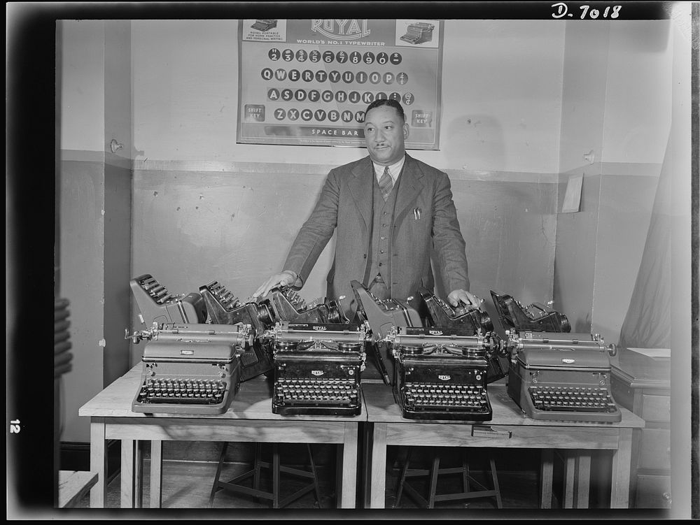 Another champ aids Army and Navy. Cortez W. Peters, world's champion portable typist, is shown with ten late model standard…