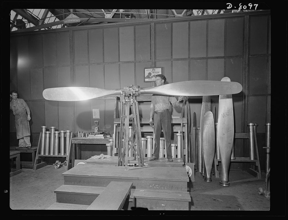 Production. Airplane propellers. Arthur Voss performs final blade balancing tests on a Hamilton airplane propeller at a…