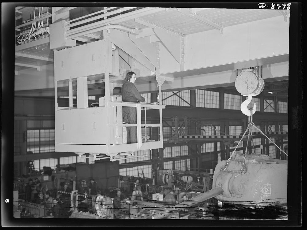 Production. M-4 tanks. Ida F. Molitor operates a heavy duty overhead traveling crane in the new combat tank shop of the…