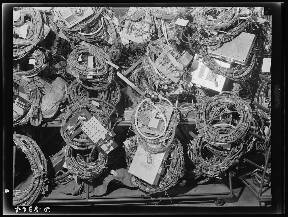 Production. B-17F heavy bomber. Electrical wiring assemblies for B-17F (Flying Fortress) bombers ready for installation at…
