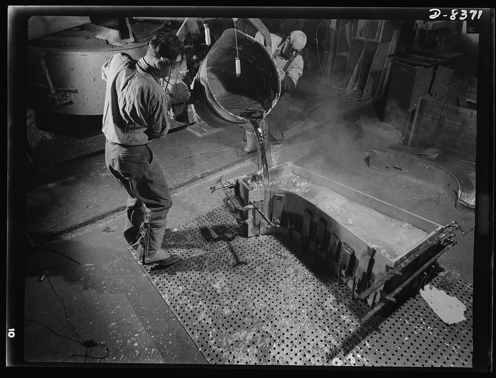 Production. B-17F heavy bomber. Pouring a lead die to be used in the production of parts for B-17F (Flying Fortress) bombers…